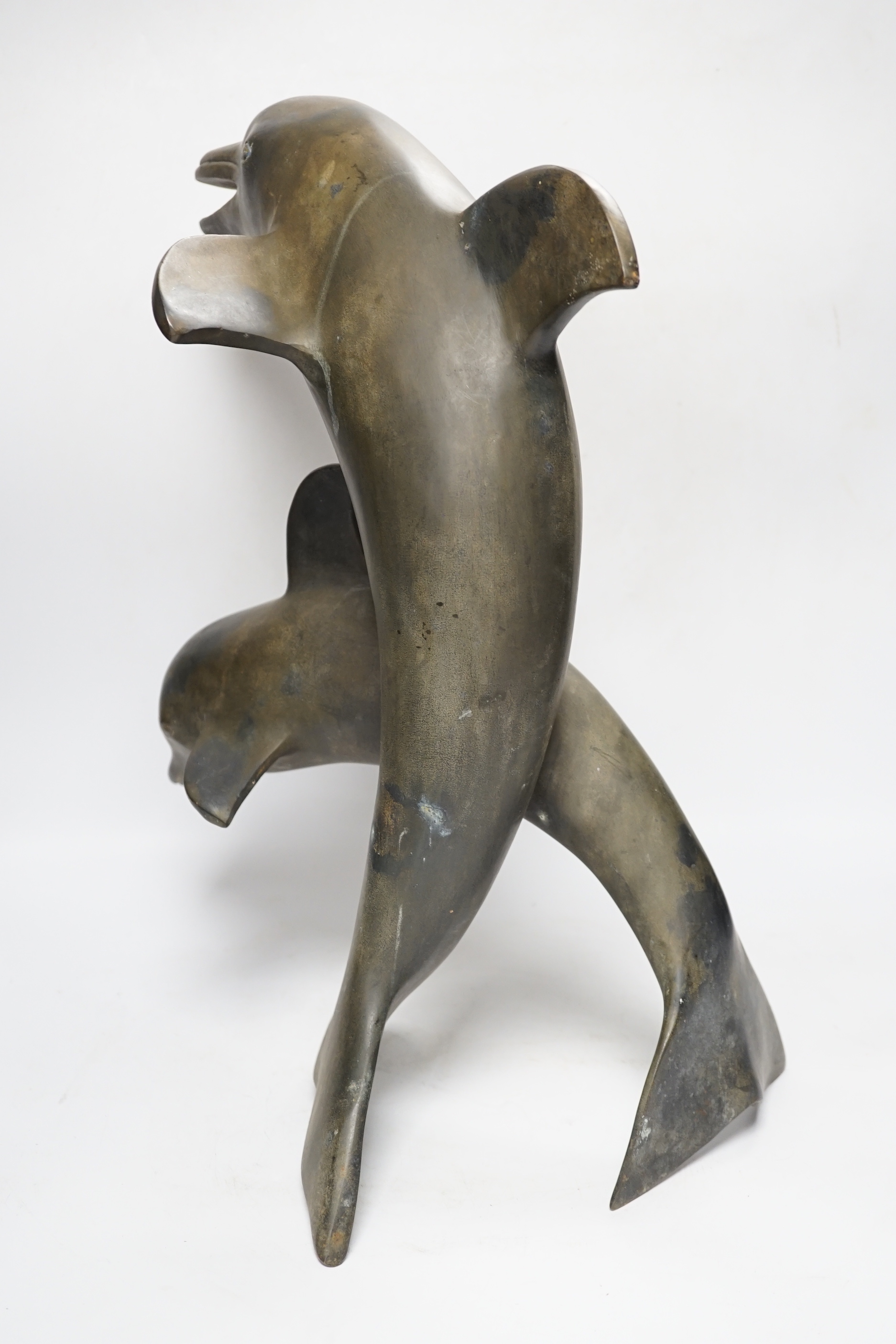 A hollow cast bronze dolphin group, 48cm